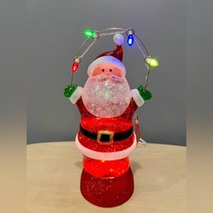 LED CONFETTI SNOWGLOBE SANTA IS NWT AND COMES WITH A USB CORD